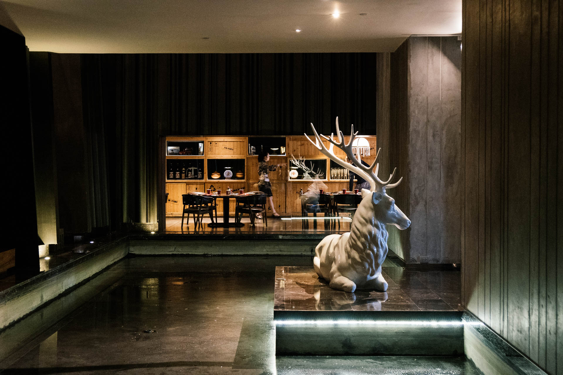 So Sofitel Bangkok Lobby space with water feature with warm hospitality atmosphere